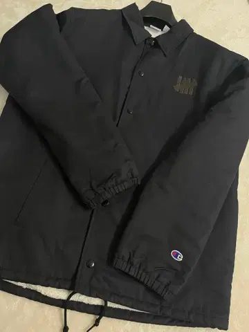 UNDEFEATED x Champion 콜라보 나일론 자켓