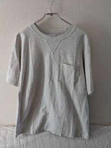 챔피온 오트밀 리버스 위브 포켓 부착