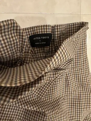 [ UNITED TOKYO ] 체크 무늬 플레어 스커트