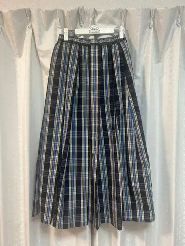 센스 오브 플레이스 바이 어반 리서치의 체크 플리츠 스커트