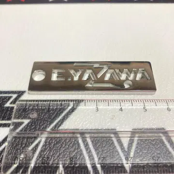 E.YAZAWA 로고 플레이트 스테인리스 소재