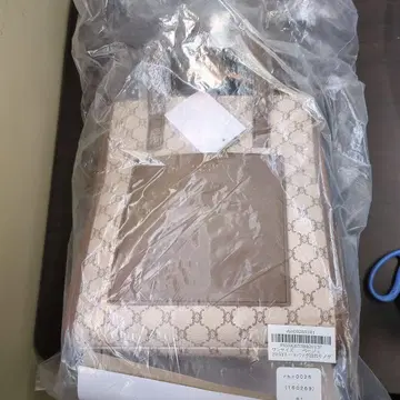 베이지 로고 패턴 숄더백