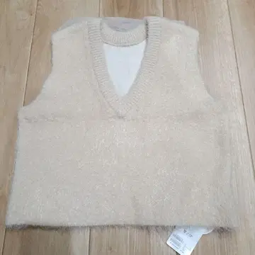 DISCOAT 전후 2WAY 페더 얀 숏 베스트 아이보리