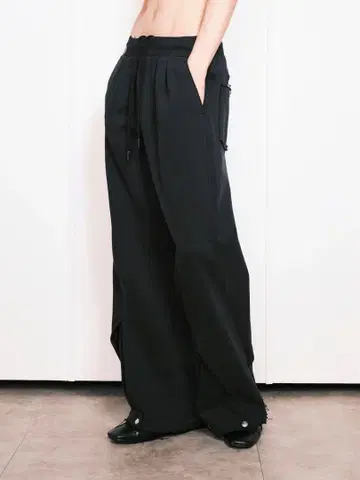 Nullus INTERTWINED STRUCTURE TROUSERS