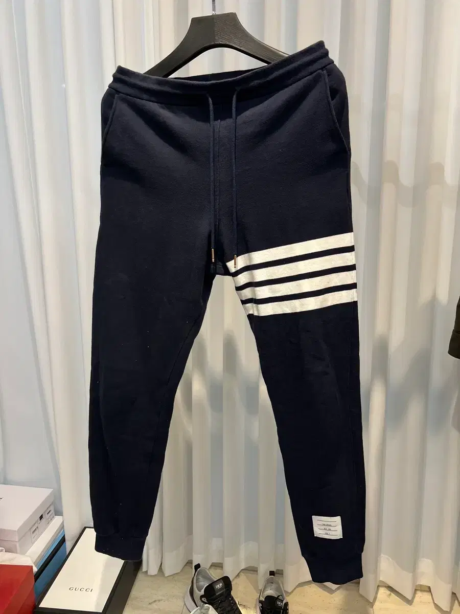 (3) Thom Browne. Diagonal Stripe Training Pants Navy