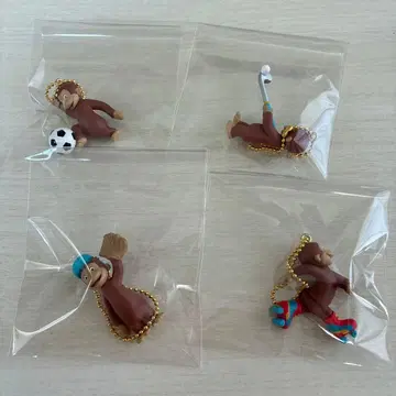 호기심 많은 조지 스포츠를 하자! 피규어 마스코트