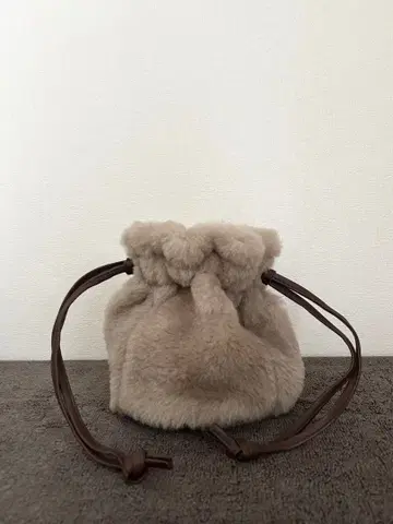 무스탕 소가죽 파우치 복조리 베이지 세무 인터내셔널