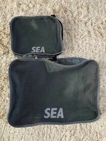 존 마스터 오가닉과 WIND AND SEA의 콜라보 트래블 파우치