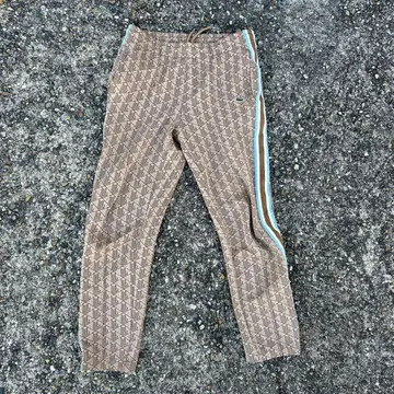 단종 초레어 LACOSTE 사이드 테이핑 모노그램 자카드 트랙 팬츠