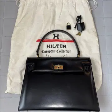 [ 새상품, 미사용 ] HILTON 블랙 가죽 핸드백