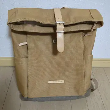 구시오 골드 베이지 롤탑 백팩
