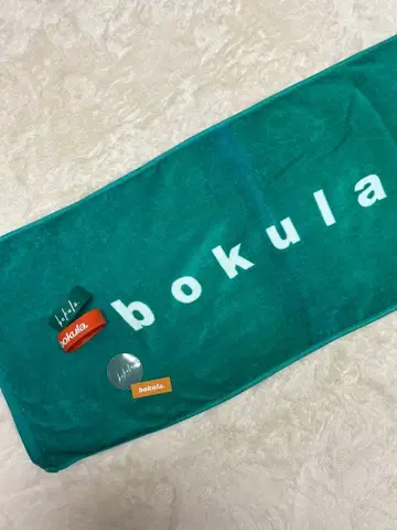 bokula. 로고 타월과 러버 밴드, 스티커