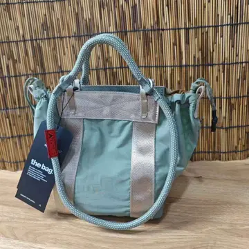 TOPOLOGIE 라이트 카키 드로우 스트링 방수 나일론 토트백