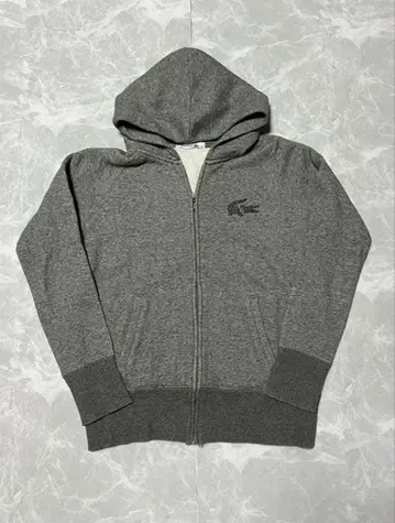 새상품급 LACOSTE 속기모 지퍼 후드티 그레이 스톤 로고 M