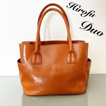 히로후 토트백 로고 엠보 카멜 브라운 포켓 듀오