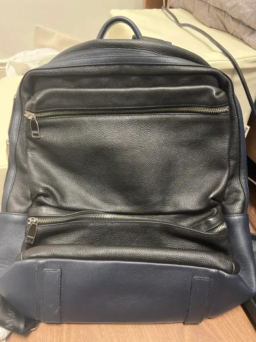 asos leather mini vintage backpack ASOS DESIGN faux leather backpack in black