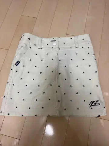 FILA 별 패턴 골프 미니 스커트 화이트