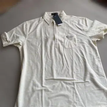 HC 엠블럼 포함 크림색 피케 셔츠