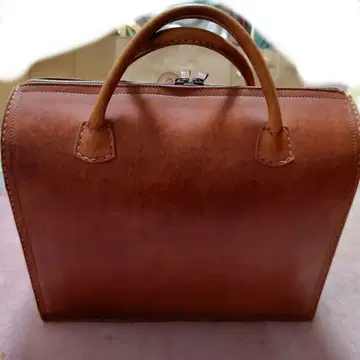 레트로 브라운 누메 가죽 트래블 백