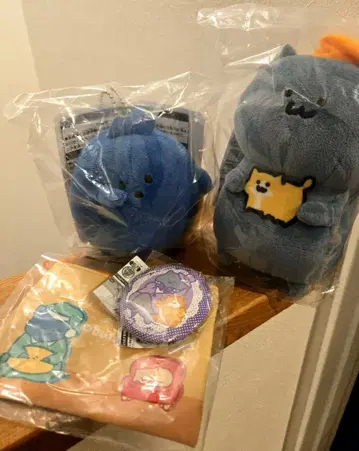 제일복권 문구와 함께 잠꾸러기 마스코트 고양이 나모 씨 배지 파우치 4종