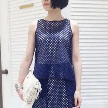 TARO HORIUCHI 펀칭 가공 슬리브리스 상의