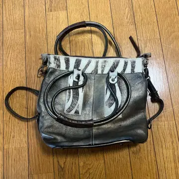 몬테로자 제브라 패턴 가죽 컴팩트 핸드백