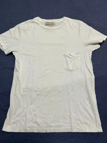 REMI RELIEF 화이트 T셔츠 포켓 부착