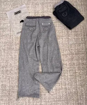 aeae 날개 모티브 자수 스트라이프 팬츠