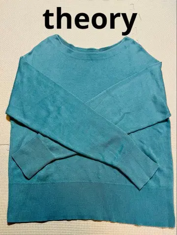 파란색 긴팔 니트 스웨터 크로스 디자인