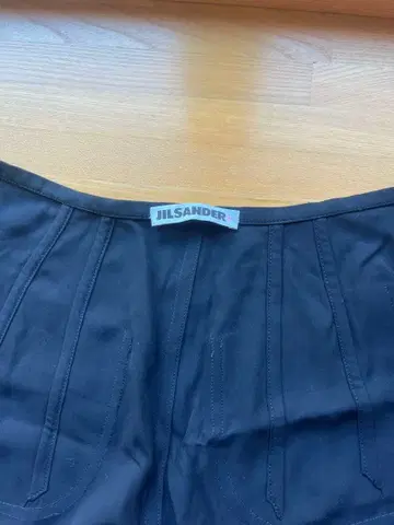 JIL SANDER 블랙 플리츠 스커트 무릎 기장