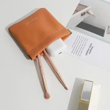 오렌지 합성 피혁 파우치 수납 포켓 포함