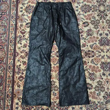 A PUZZLING HOME COATING BOOTS CUT PANTS