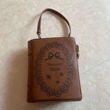 Innocent World 브라운 핸드백