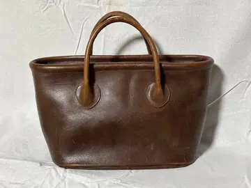 브라운 가죽 토트백 지퍼 포함
