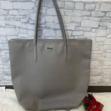 라코스테의 L.12.12 컨셉 엠보싱 PVC 토트백