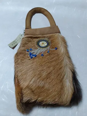 퍼와 스웨이드 핸드백