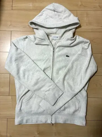 라코스테(LACOSTE) 화이트 후드티