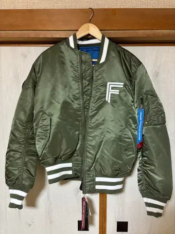 ALPHA x 파이터즈 MA-1 카키