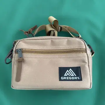 그레고리 패디드 숄더 파우치 S 브라운