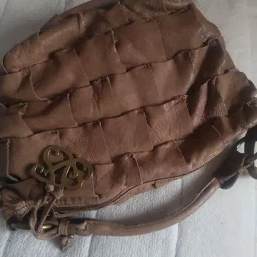 브라운 가죽 뜨개질 핸드백 zucchero filato