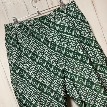 LACOSTE NETFLIX 콜라보 팬츠 올 패턴 나일론 팬츠 조거 팬츠