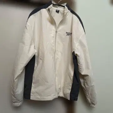 리복 ] 별주 스몰 벡터 자수 밑단 드로스트 나일론 자켓