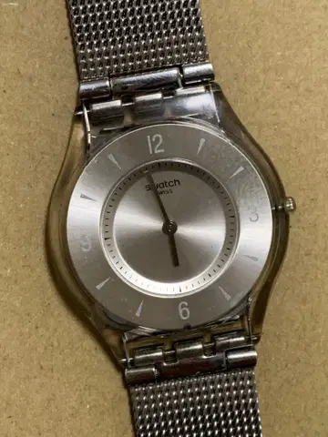 Swatch 아날로그 쿼츠 손목시계 실버