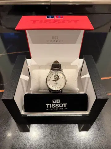 TISSOT 트래디션 오토매틱 오픈 하트 자동 와인딩