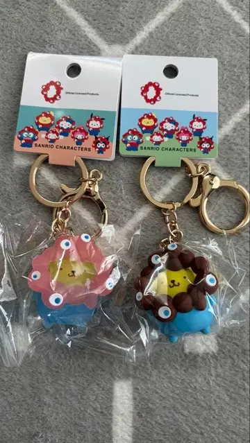 오사카 간사이 만박 산리오 미야쿠미야쿠 키링 폼폼푸딩 2종 세트