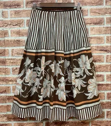 피노레 PINORE 꽃무늬 플레어 스커트 브라운 계열 라메 스커트
