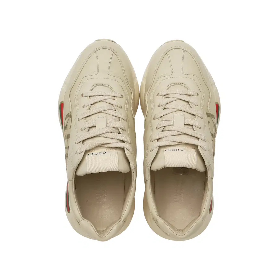 (W) Gucci Rhyton皮革运动鞋，饰有条纹标志