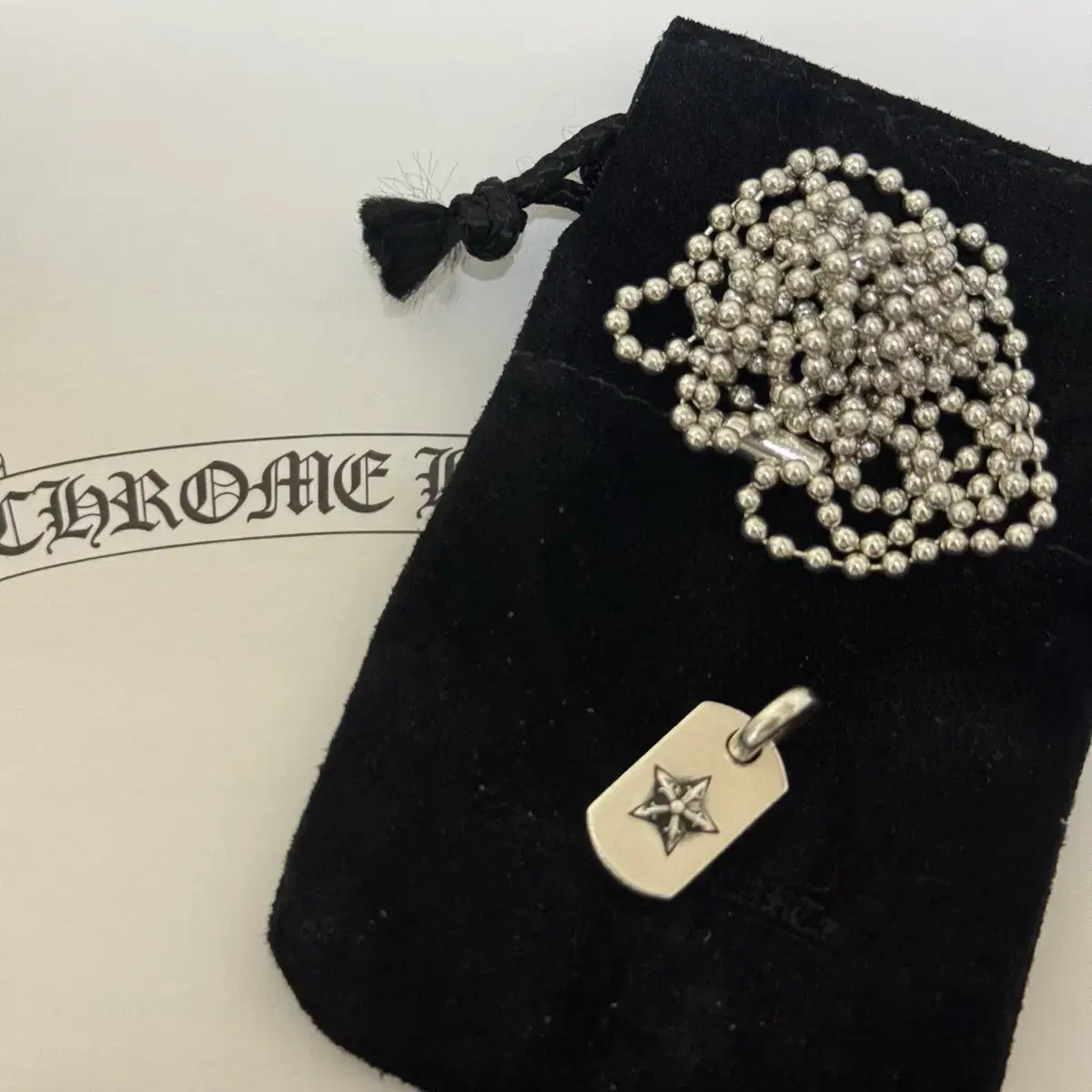 Chrome Hearts Tiny Star Dog Tag on Bunjang Global Site.