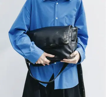 CLESSTE LEATHER PADDED FLAP HOLIDAY BAG