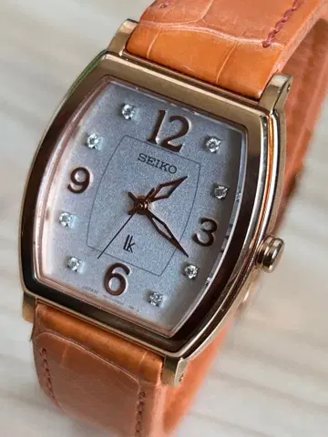 여성용 SEIKO 루키아 쿼츠 실버/오렌지. 작동품